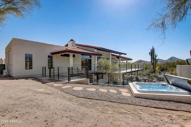 back of house with a mountain view