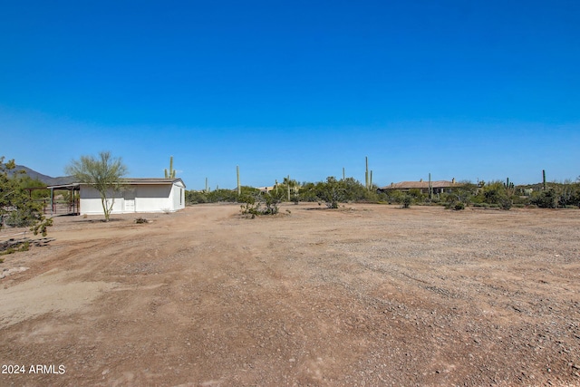 view of yard with a rural view