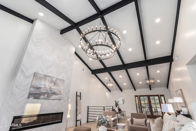 living room with beamed ceiling and high vaulted ceiling