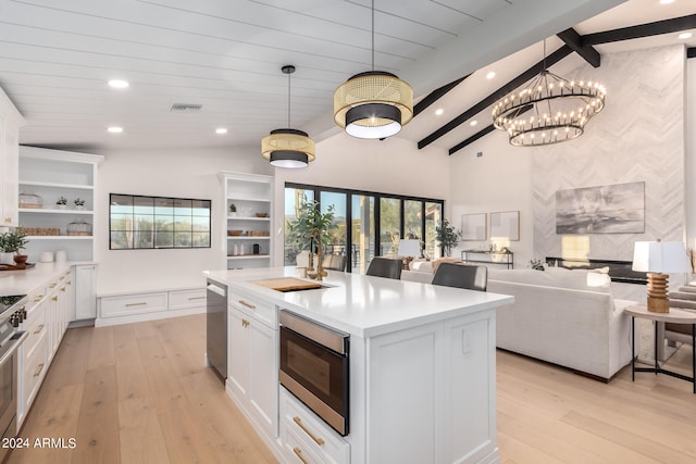 kitchen with vaulted ceiling with beams, light hardwood / wood-style floors, and white cabinetry