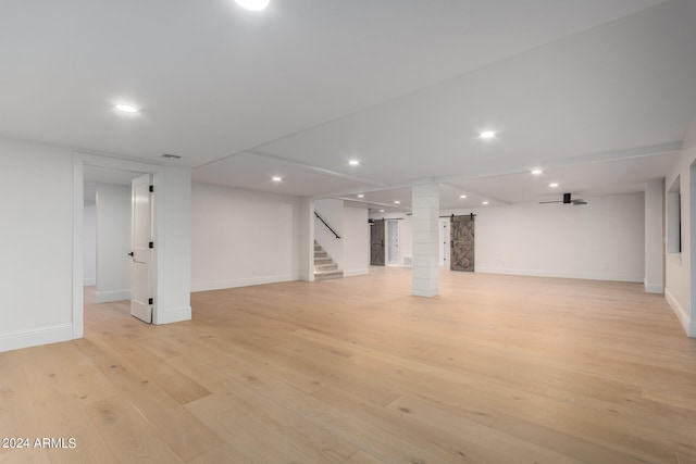 basement featuring light hardwood / wood-style flooring