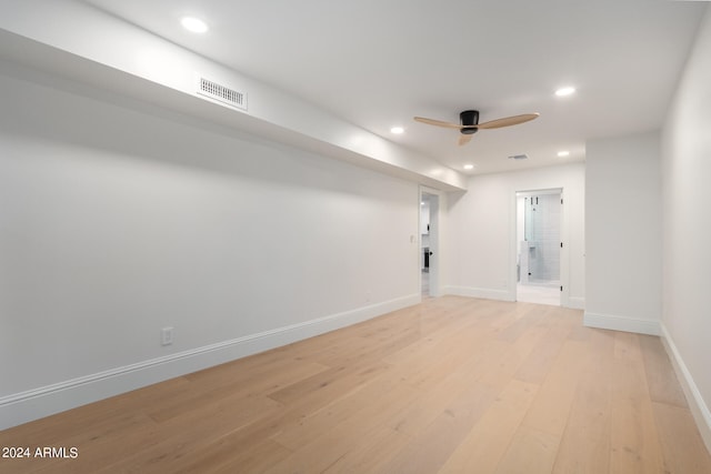 empty room featuring ceiling fan and light hardwood / wood-style flooring