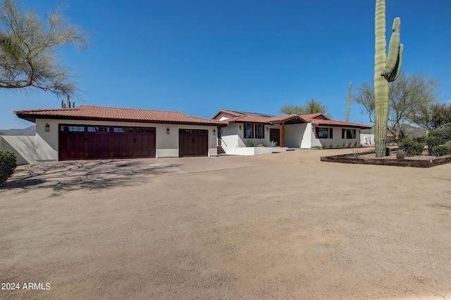 ranch-style house featuring a garage