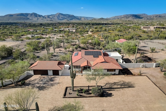 birds eye view of property with a mountain view