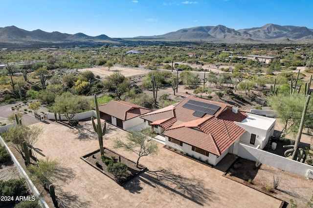 birds eye view of property featuring a mountain view