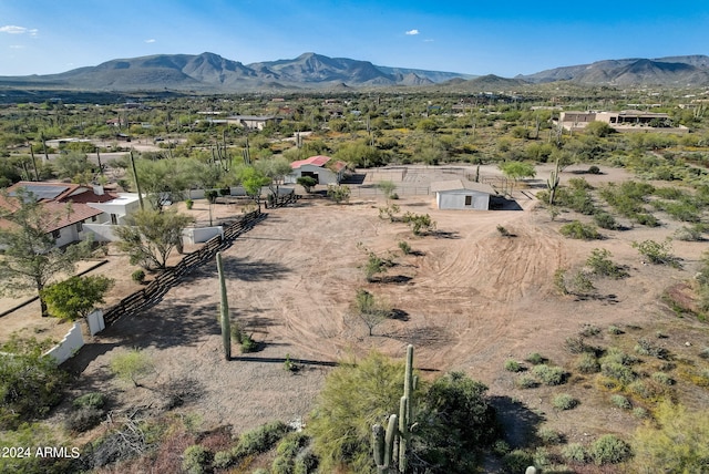 birds eye view of property with a mountain view