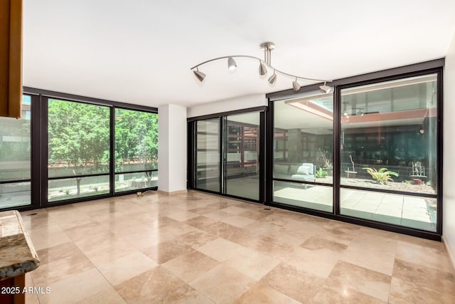 spare room featuring expansive windows
