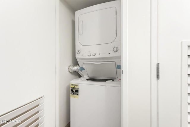 washroom with stacked washer / dryer