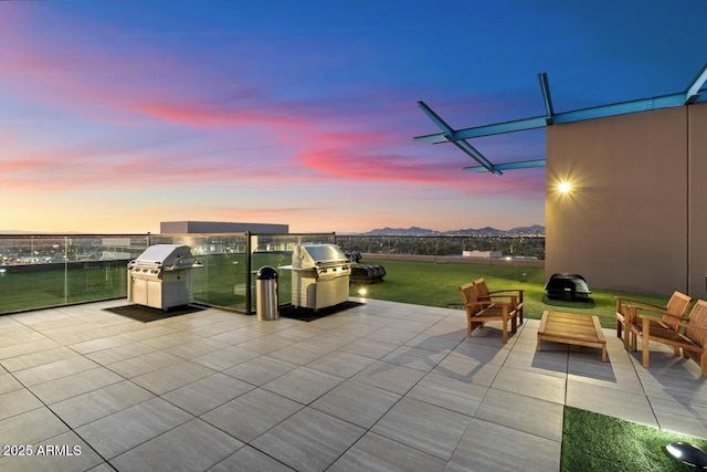 view of patio / terrace featuring area for grilling and a mountain view