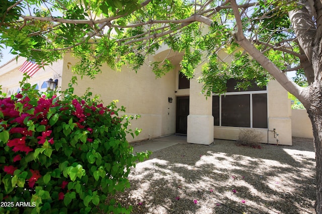 exterior space featuring stucco siding