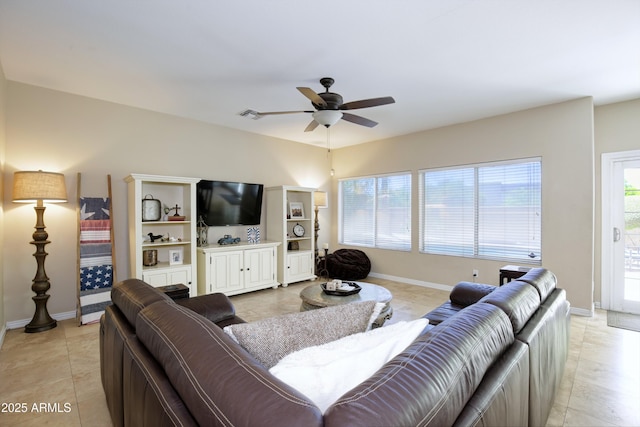 living area with light tile patterned floors, baseboards, a ceiling fan, and visible vents