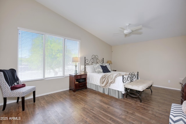 bedroom featuring baseboards, a ceiling fan, wood finished floors, and vaulted ceiling