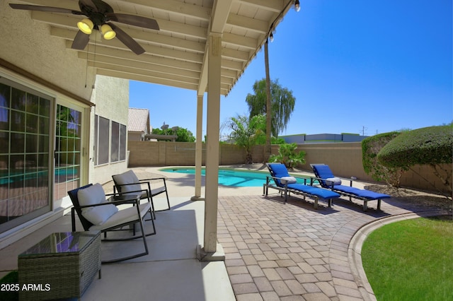 view of patio / terrace featuring ceiling fan, a fenced in pool, and a fenced backyard