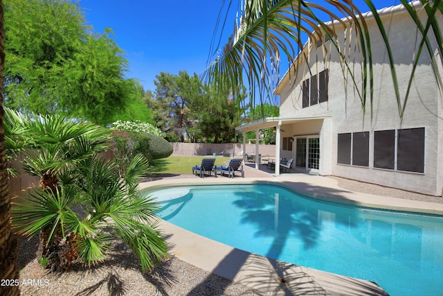 view of swimming pool featuring a patio, a fenced backyard, and a fenced in pool