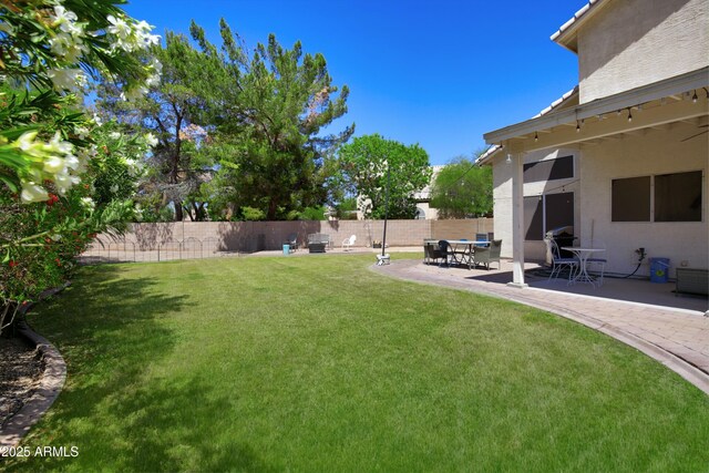 view of yard with a fenced backyard and a patio area