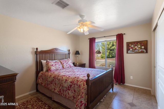 tiled bedroom with a ceiling fan, baseboards, and visible vents