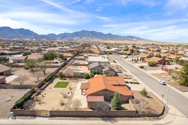 birds eye view of property with a mountain view and a residential view