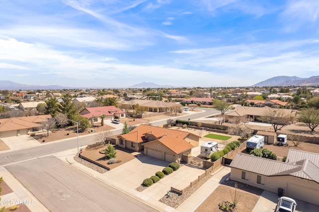 drone / aerial view featuring a mountain view and a residential view