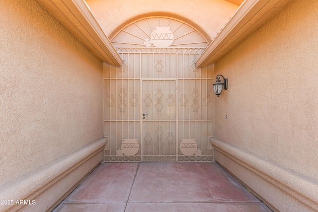 entrance to property with stucco siding