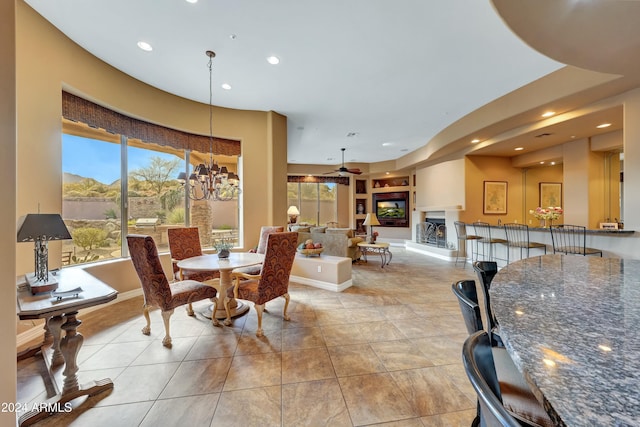 tiled dining area with a notable chandelier