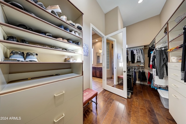 spacious closet with dark wood-type flooring