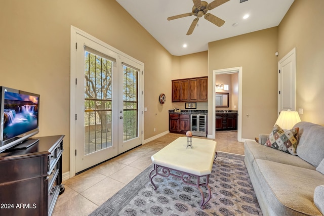 living room featuring light tile patterned floors, french doors, wine cooler, and ceiling fan