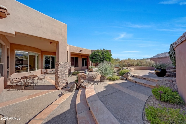 view of patio with a mountain view