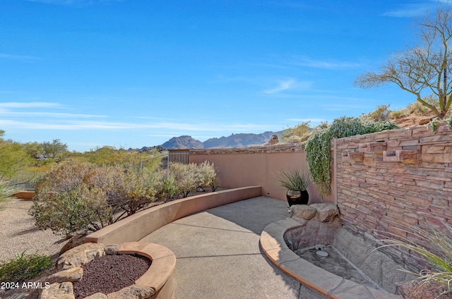 view of patio / terrace with a mountain view