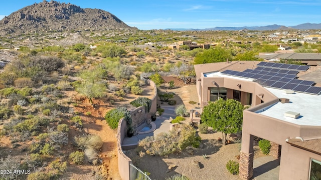 birds eye view of property featuring a mountain view