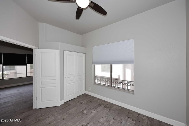 8180 E Shea Blvd Unit 1075, Scottsdale, AZ 85260 - unfurnished bedroom with wood finished floors, a closet, baseboards, and ceiling fan