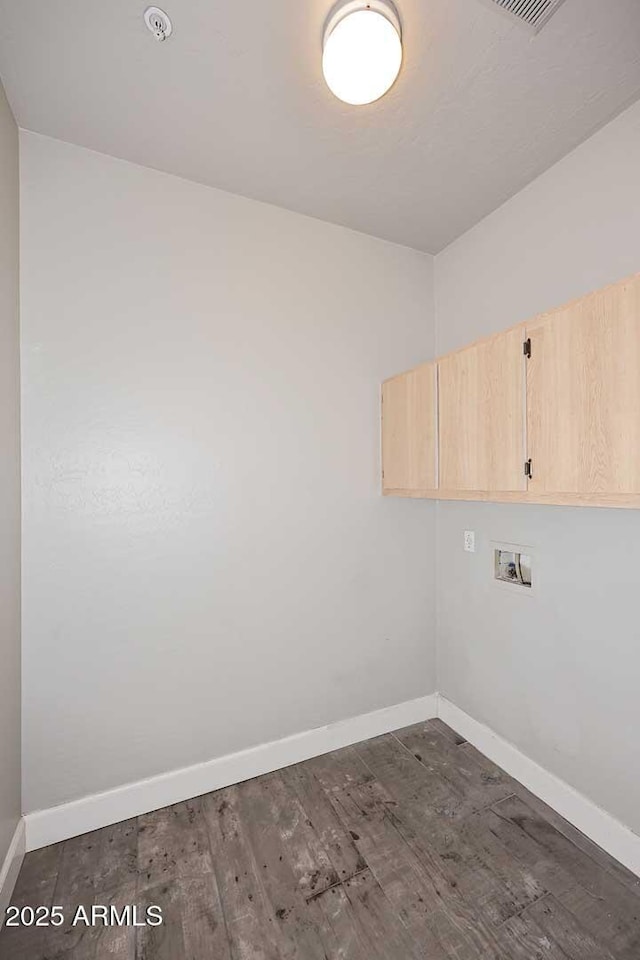 8180 E Shea Blvd Unit 1075, Scottsdale, AZ 85260 - laundry area with cabinet space, baseboards, washer hookup, and dark wood-style floors