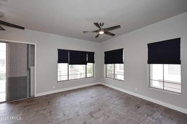 8180 E Shea Blvd Unit 1075, Scottsdale, AZ 85260 - empty room with ceiling fan, dark wood finished floors, and baseboards