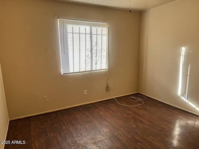 empty room featuring dark hardwood / wood-style floors