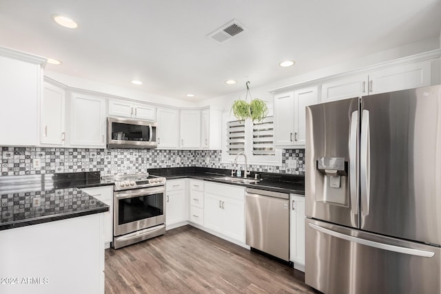 kitchen featuring white cabinetry, sink, and stainless steel appliances