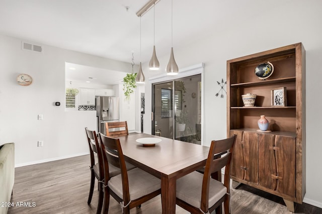 dining area with wood-type flooring