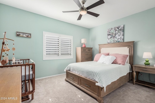 carpeted bedroom featuring ceiling fan