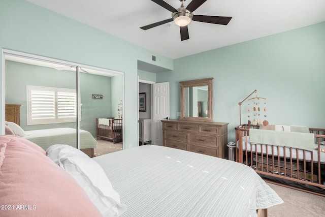 bedroom featuring carpet flooring, ceiling fan, and a closet