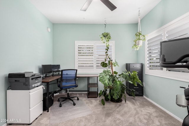 home office with ceiling fan and light colored carpet