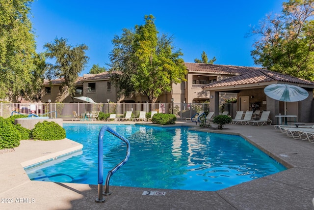 view of swimming pool with a patio area