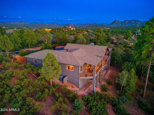 birds eye view of property with a mountain view