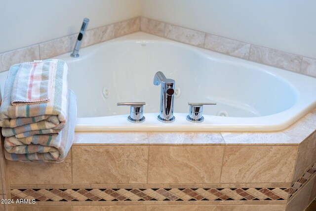 bathroom with tiled bath