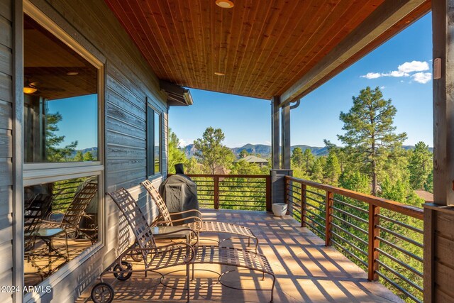 wooden terrace with a mountain view