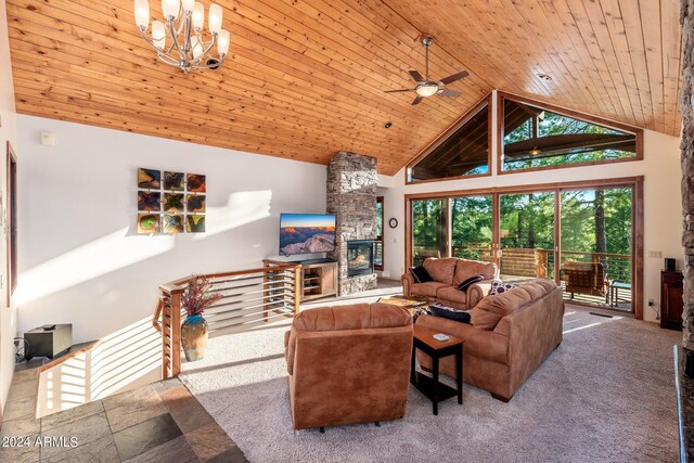 living room with high vaulted ceiling, ceiling fan with notable chandelier, carpet flooring, wooden ceiling, and a stone fireplace