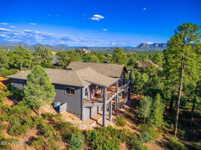 birds eye view of property featuring a mountain view