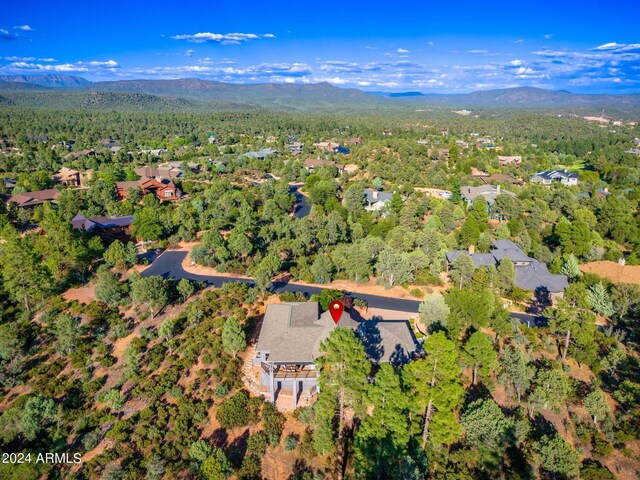 birds eye view of property with a mountain view