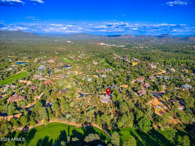 birds eye view of property with a mountain view