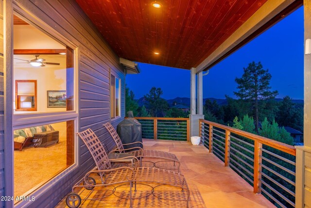 view of balcony at twilight