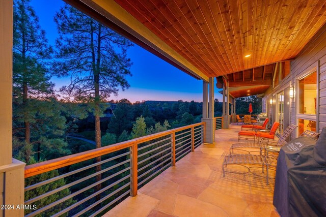 view of patio terrace at dusk