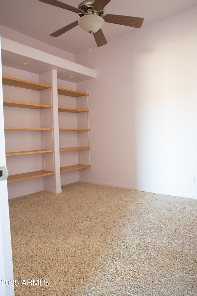 interior space with ceiling fan