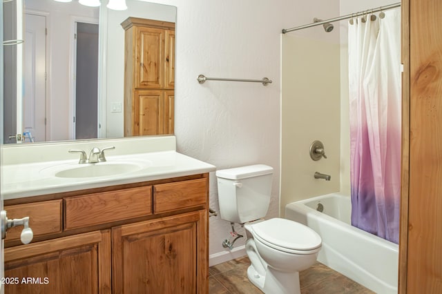 full bath with shower / bath combo, vanity, toilet, and wood finished floors